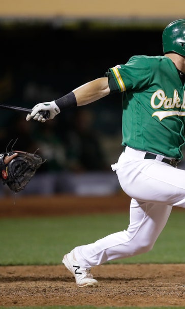 A's edge Astros 3-2 in 13 to inch closer in playoff chase